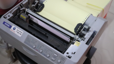 An old-fashioned Epson fax machine showing the difference between the traditional model and the newer software for online faxing